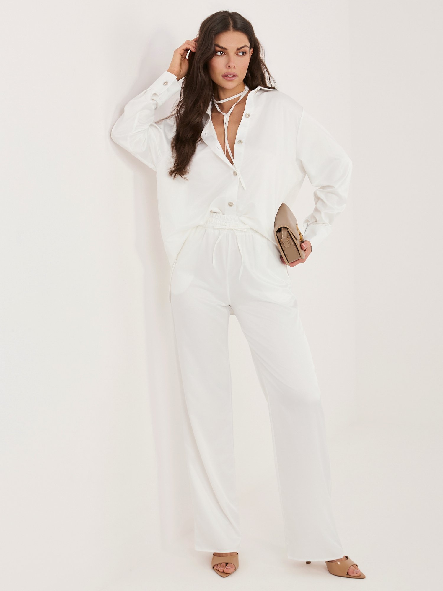 White elegant set with an unbuttoned shirt