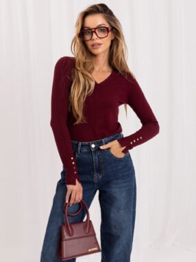 Burgundy fitted sweater with a V-neck.