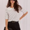White elegant polka dot blouse.