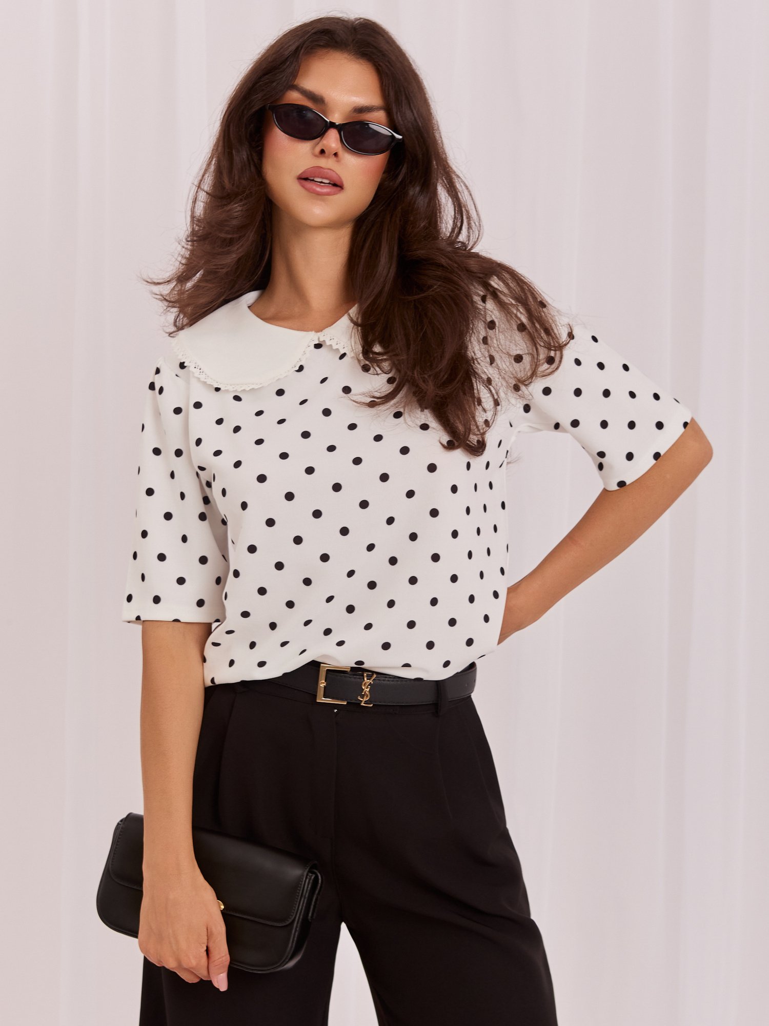 White elegant polka dot blouse.