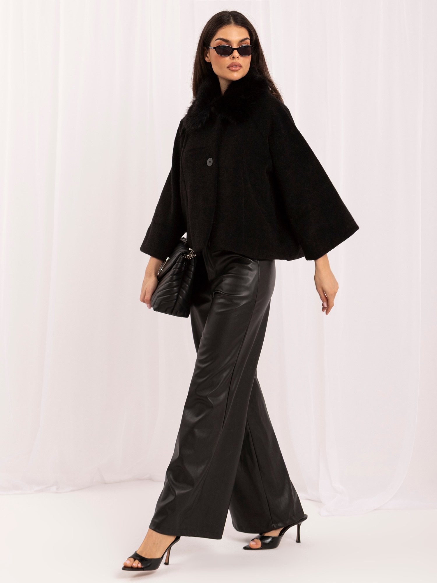 Black trapeze coat with button closure
